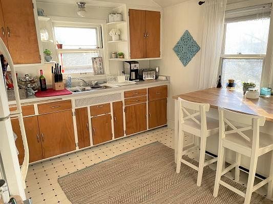 More kitchen view; plenty of cabinets