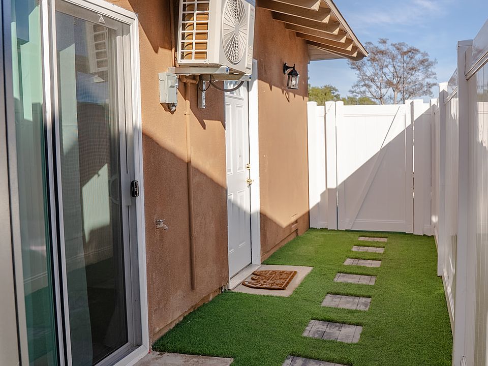 Private entrance and turfed side yard
