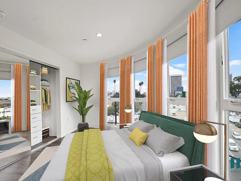 Modern Bedroom with Lots of Windows Providing Natural Light and a Mirrored Closet with Built-In Organizers
