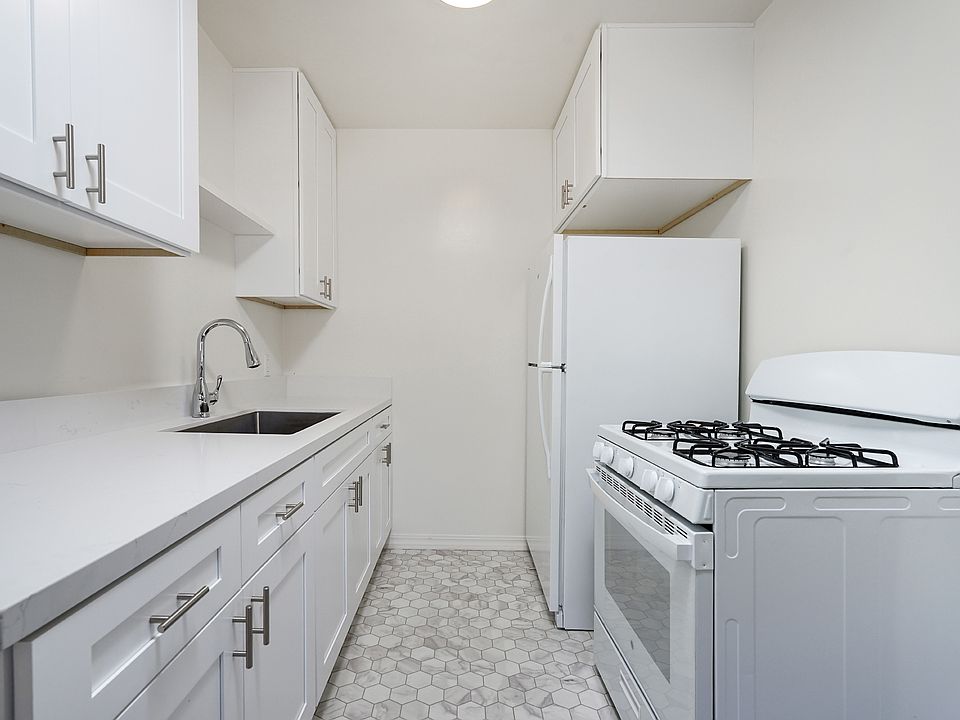 Remodeled kitchen with quartz counters and new appliances