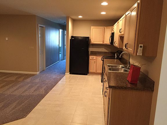 Another view of the kitchen area. You can see the coat closet at the entrance to the hall on the left and you can see the entrance to the master farther down on the left.
