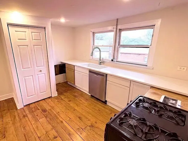 Kitchen with laundry closet.