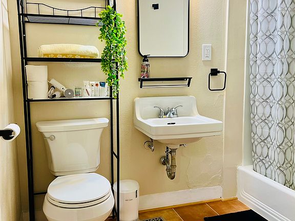 Renovated bathroom with brand new hardwares, tile floor and fresh paint