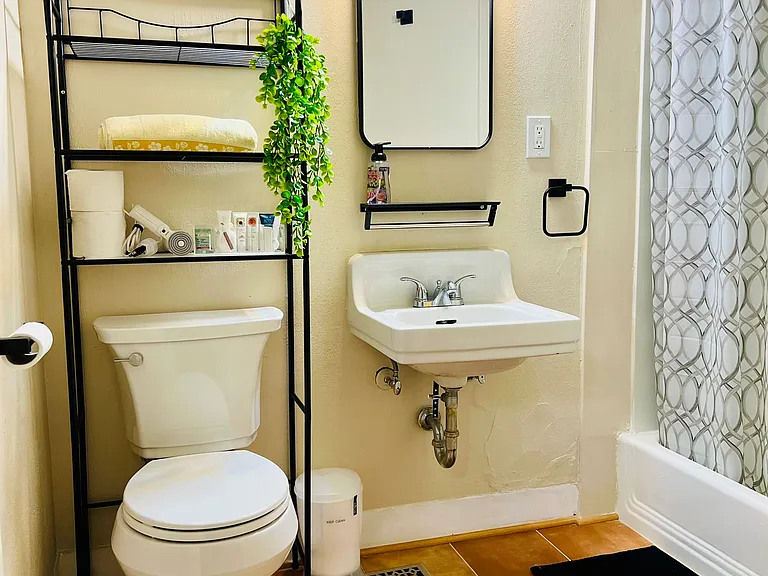 Renovated bathroom with brand new hardwares, tile floor and fresh paint