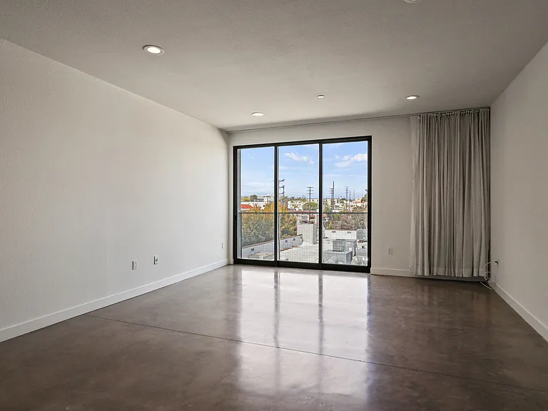 Living Room Area with Recessed Lighting, Polished Concrete Flooring, and Balcony