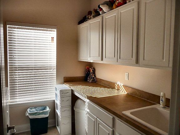 laundry room with lots of storage