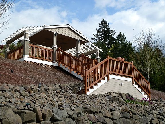 A small fortune has been spent in landscaping this home. Beautiful terracing & rocked walls.
