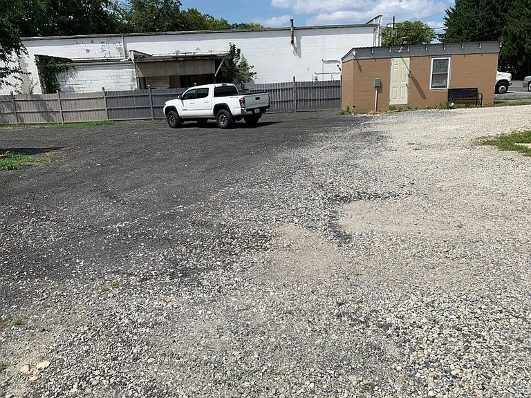 Parking lot next to garage