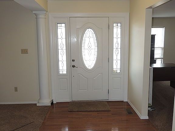 Entryway with hardwood floor