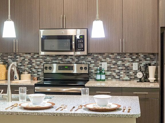 Open concept kitchen with granite countertops