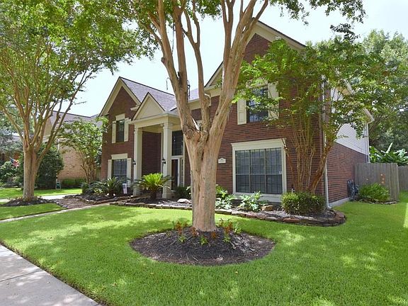 Lovely landscaping with mature trees.