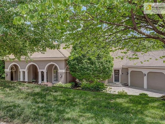 Unique rvs. 1.5 story w/professional landscaping, tile roof, stamped concrete drive....