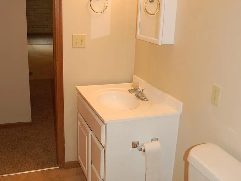 First bathroom with medicine cabinet