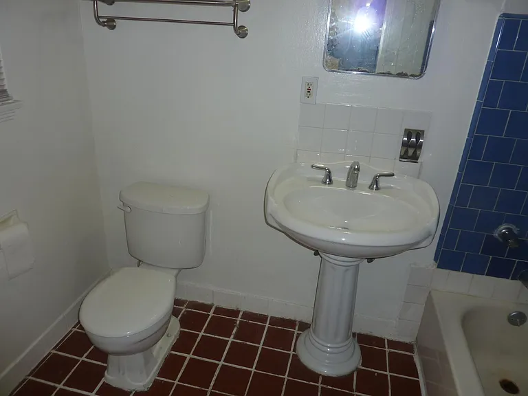 Bathroom accessible from bedroom.