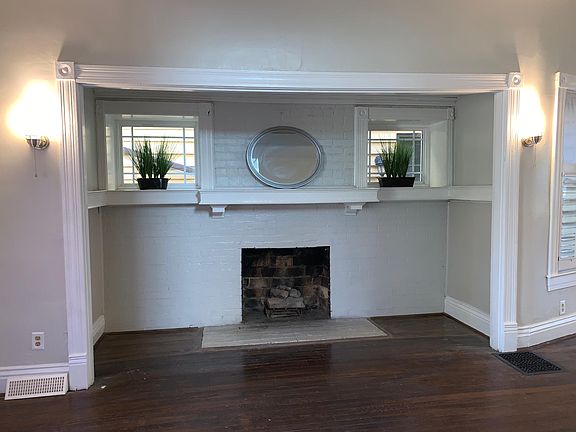 Charming mantle and great place to put chairs to sit and read.