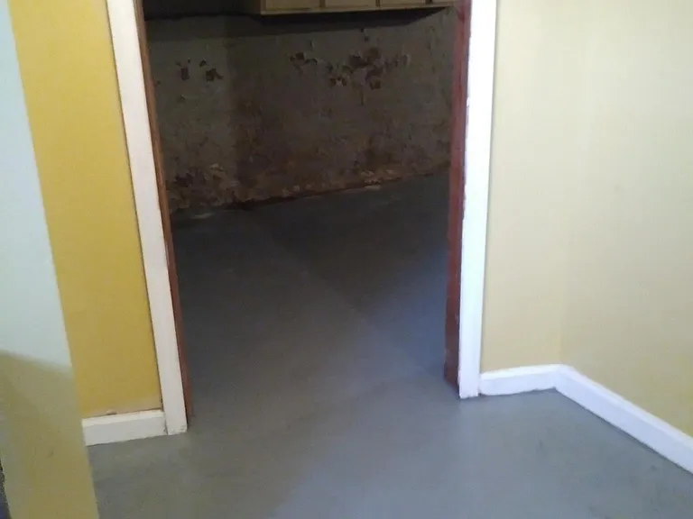 Basement to unfinished utility and laundry room