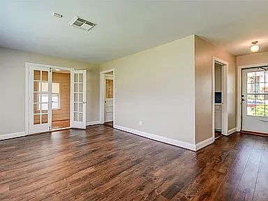 living room with French door to the flexible room