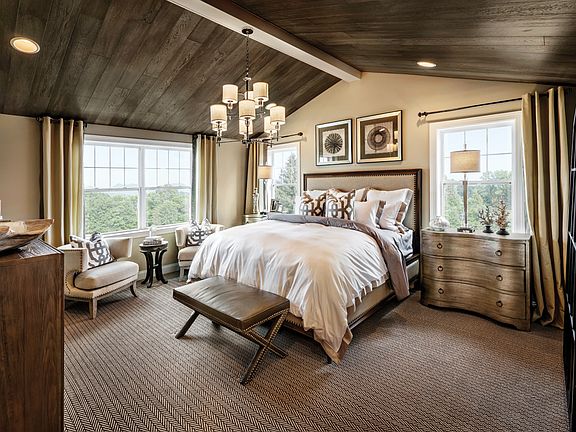 Luxurious primary bedroom suite