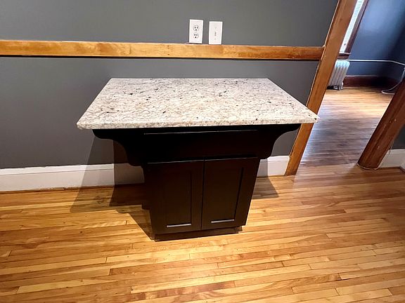 built in island in kitchen with granite top