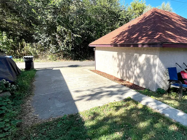 Parking slab for upper unit, and one parking spot in garage.