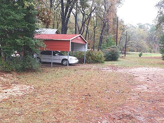 Carport. Going into the driveway view.