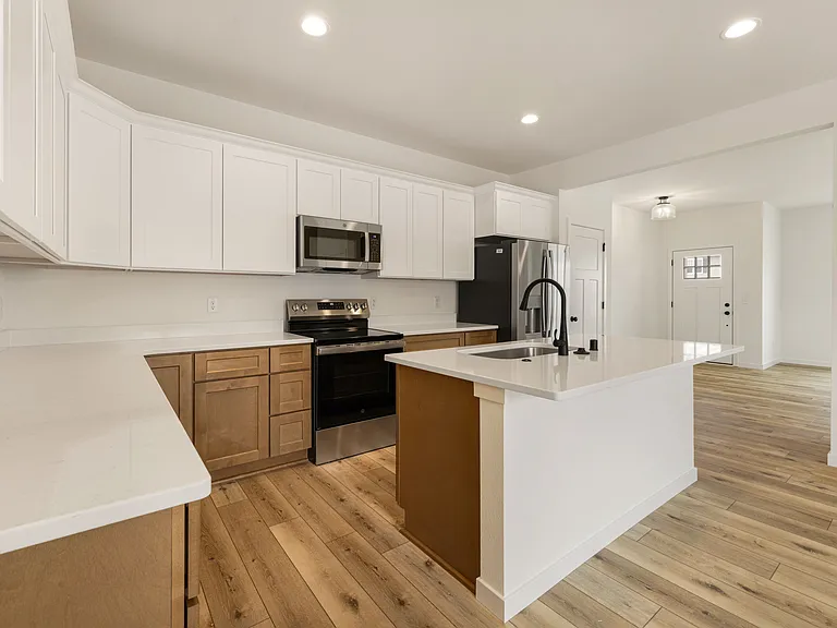Chef Worthy Kitchen - Large Island, Breakfast Bar Seating, Abundant Cabinet Space & Stainless Steel Appliances!