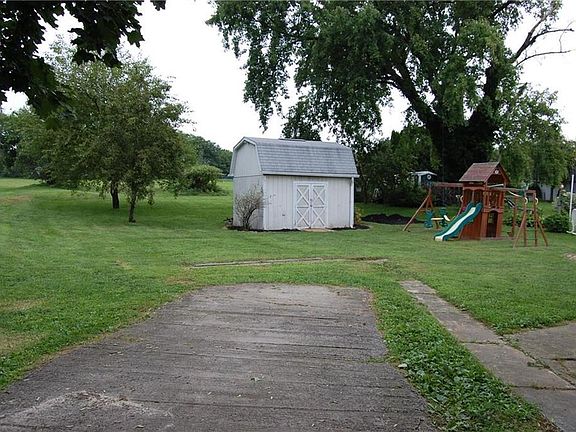 Off-Street parking pad, large shed, yard backs up to municipal field