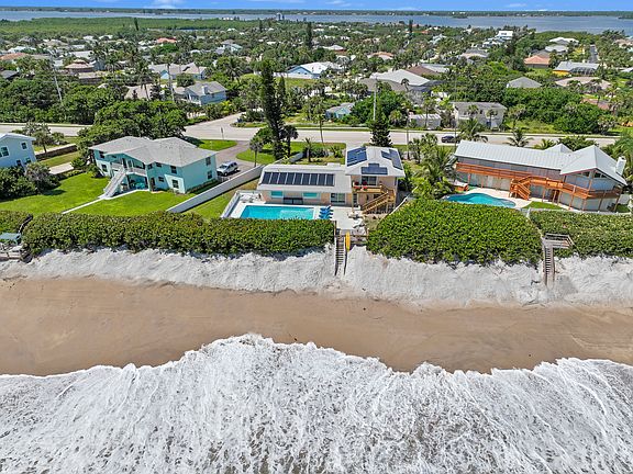 Downstairs main house: 3 bedrooms, 3 full bathrooms, full kitchen, laundry room, stunning beach views. 
Upstairs: In-law suite - 2 bedrooms, 1 bath, full kitchen (no dishwasher), ocean front balcony