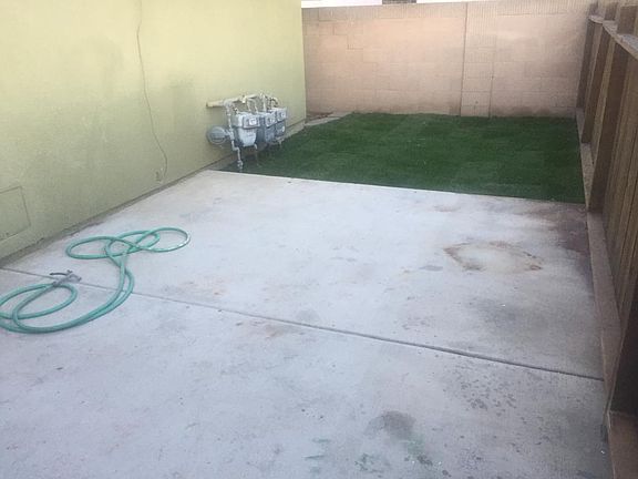 private yard with door off kitchen