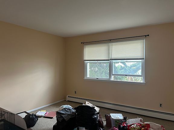 Queen size bedroom double window facing street.