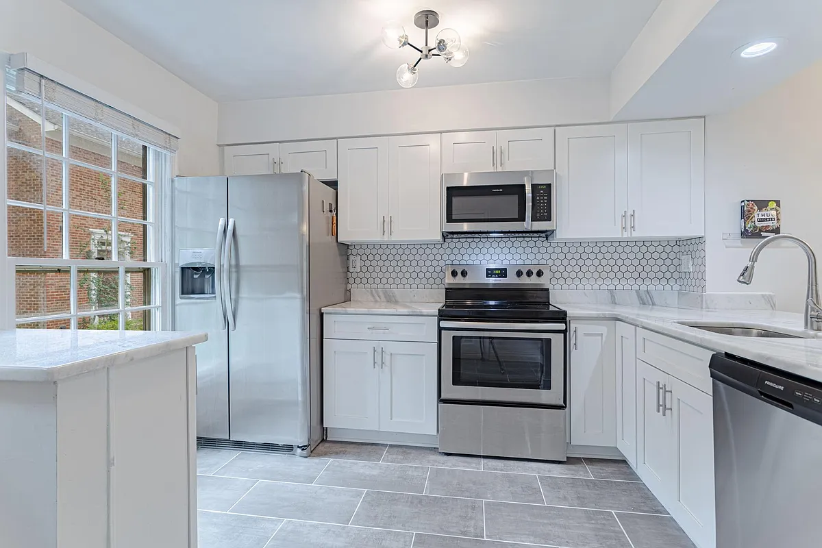 kitchen with new tile and backsplash - 2440 S Walter Reed Dr #D
