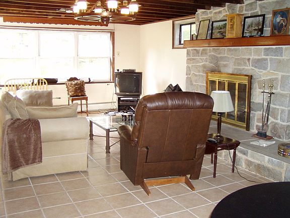 New family room w large stone fireplace