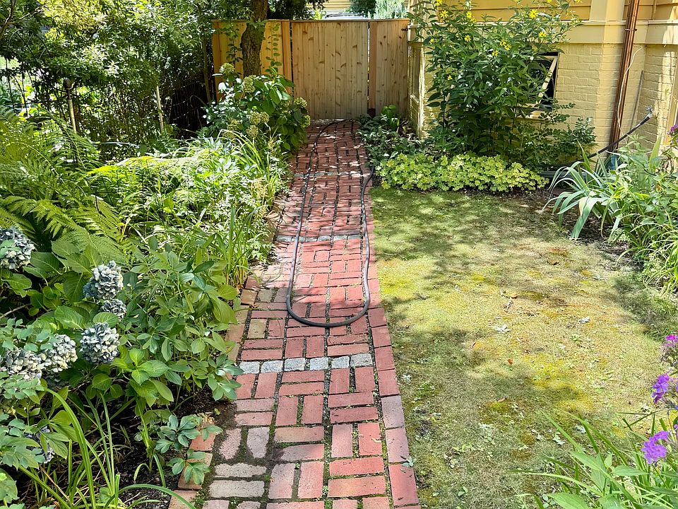Private path to basement unit.
