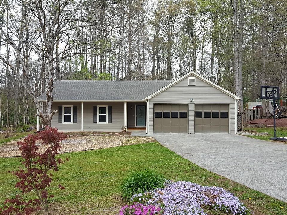 Front of home; home contains new windows, new roof, garage w