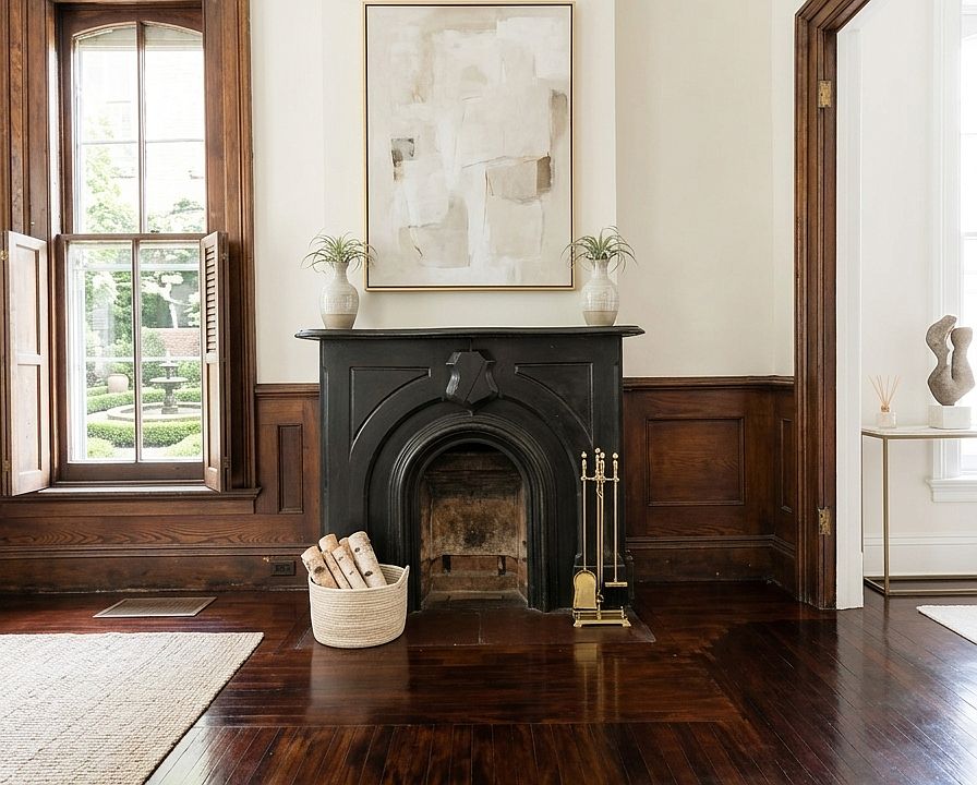 Original stone fireplace adds a cozy and traditional charm to the living space