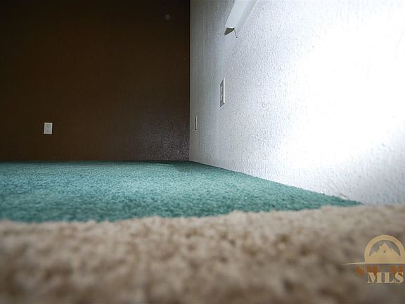 Won't this neutral carpet freshen the property and bolster the natural light?
