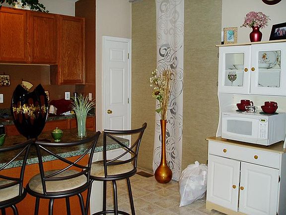 Island stools can stay, microwave and stand can stay if rent