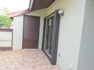 FRONT PATIO WITH STORAGE UNIT