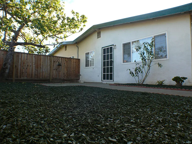 Front view with spacious private yard
