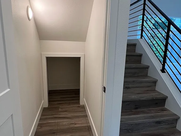Large storage space next to stairs