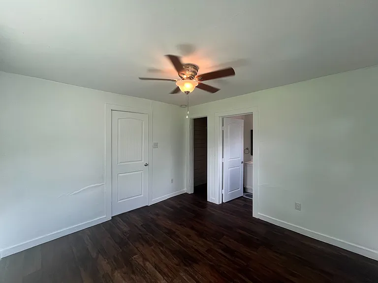 Primary bedroom with bathroom and closet