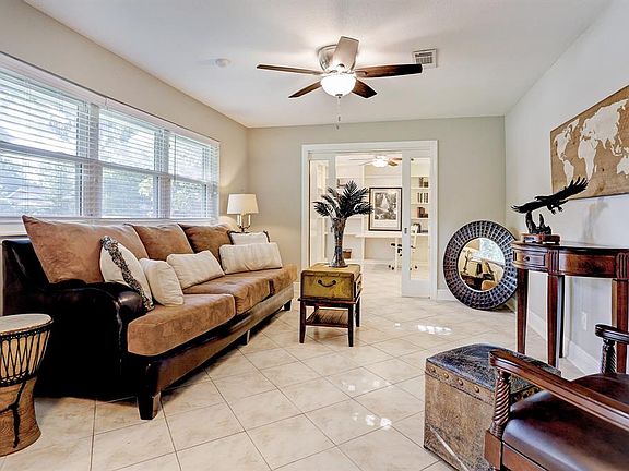 Enter into what is the Living room or can be the Dining Room. Beyond that are glass doors that are retractable and that can be your home study/office.