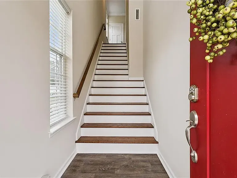 Main door and the staircase leading to the second floor