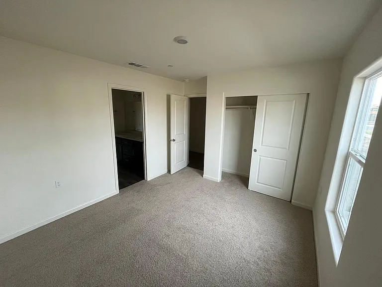 Bedroom 4 with entrance to the Jack & Jill style (shared) Bathroom
