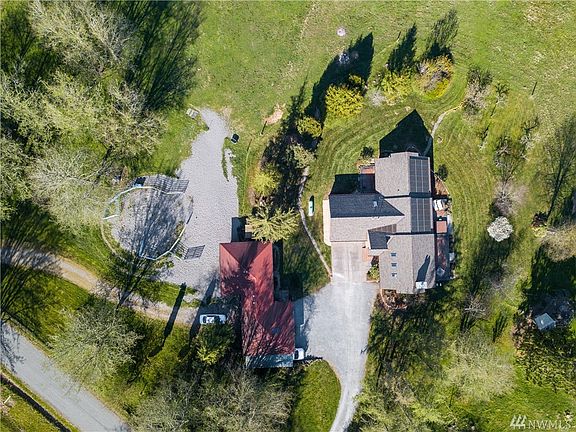 House is sighted to give maximum privacy to the living areas and bedrooms, with outbuildings that have been used for boarding horses, hay storage and more!
