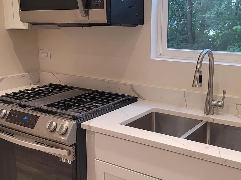 Partial Kitchen view with self-closing doors/drawers