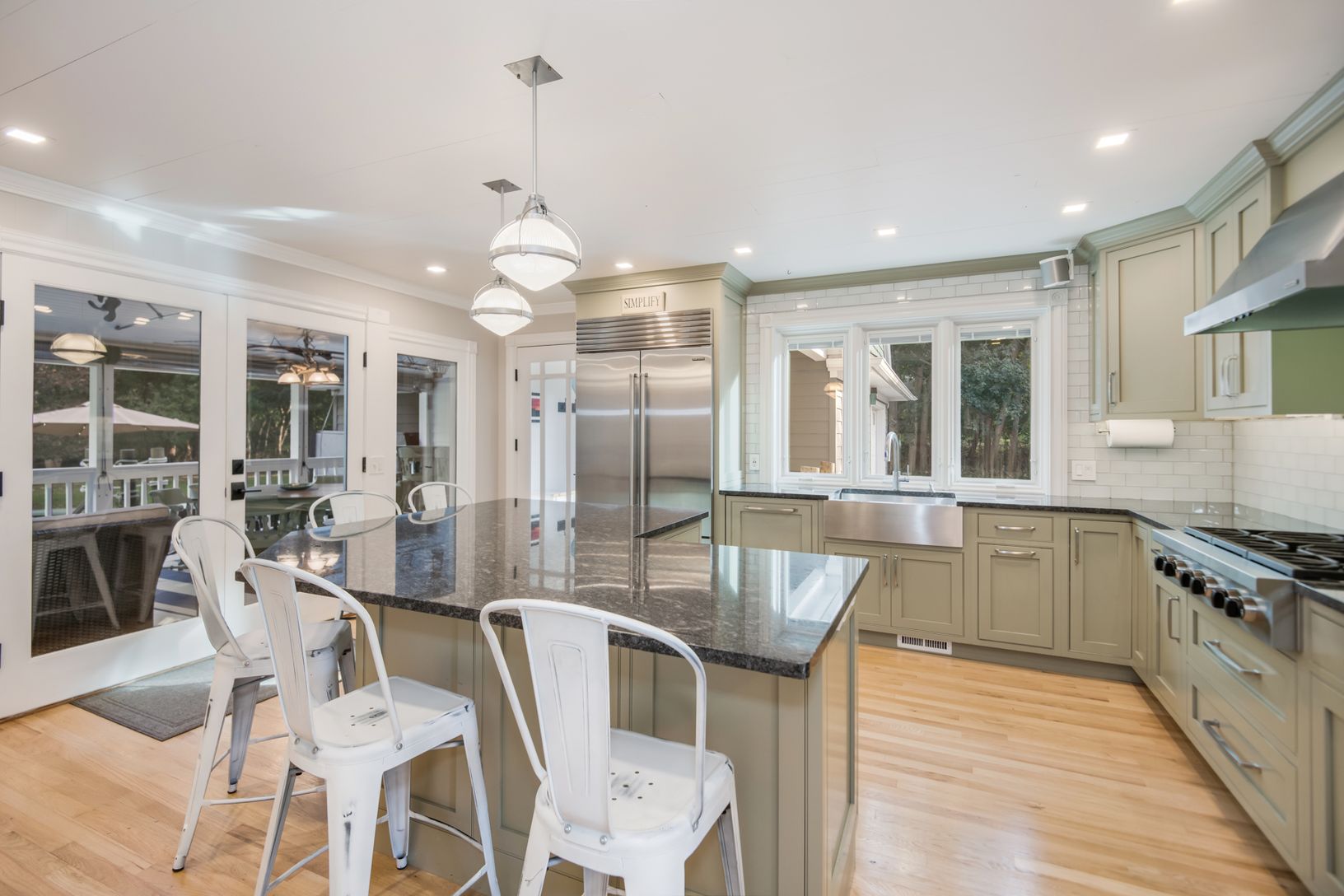  Kitchen Featuring Stainless Steel Appliances, Black Granite Countertops, Wolf 6 Burner Gas Cooktop