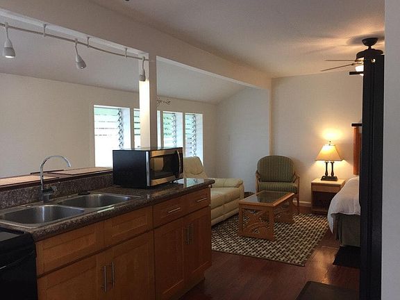 Full kitchen with stove and basic kitchen items.