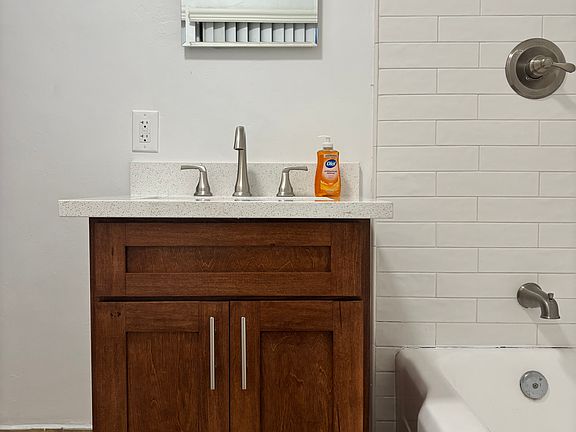 Bathroom vanity and tub