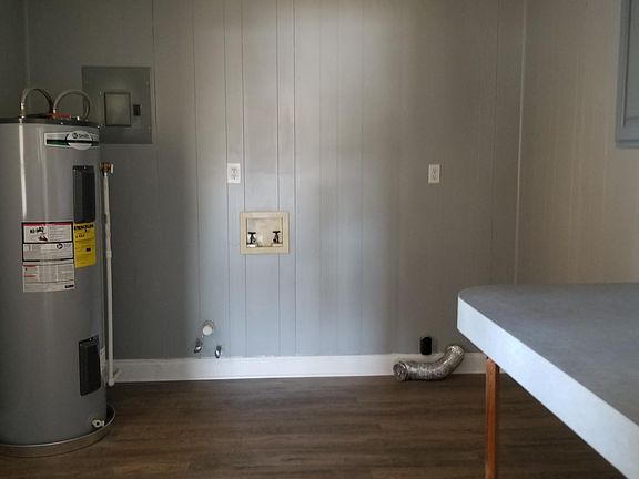 Laundry Room with built-in folding table and cabinet with rod